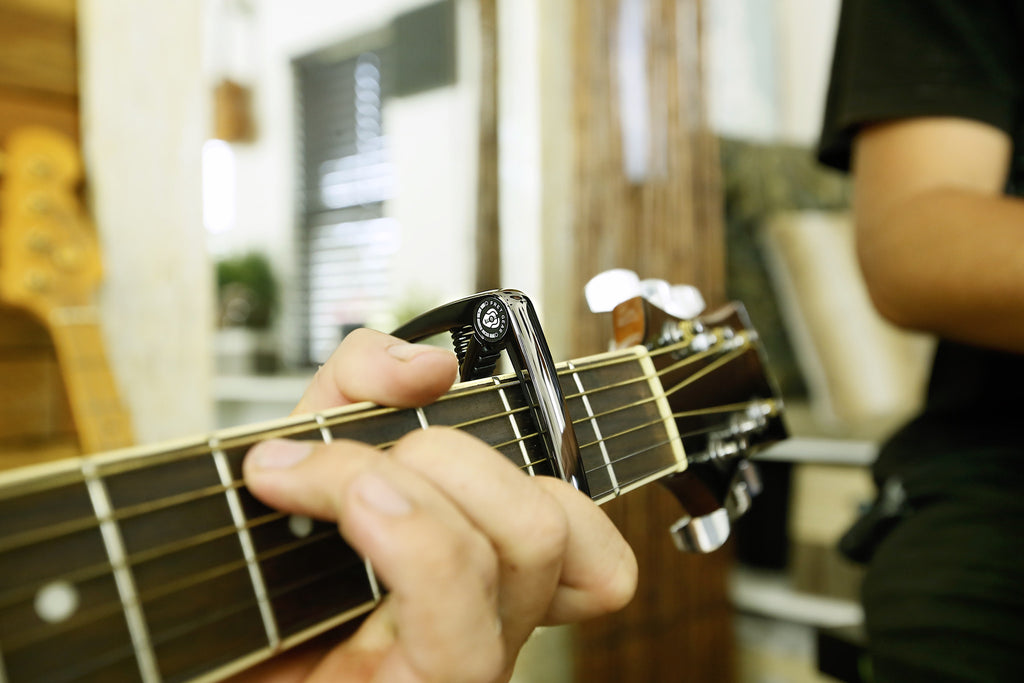 The Ultimate Capo Song List for Guitar Players